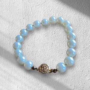 Pearl bracelet w/ St. Benedict medal w/box clasp.